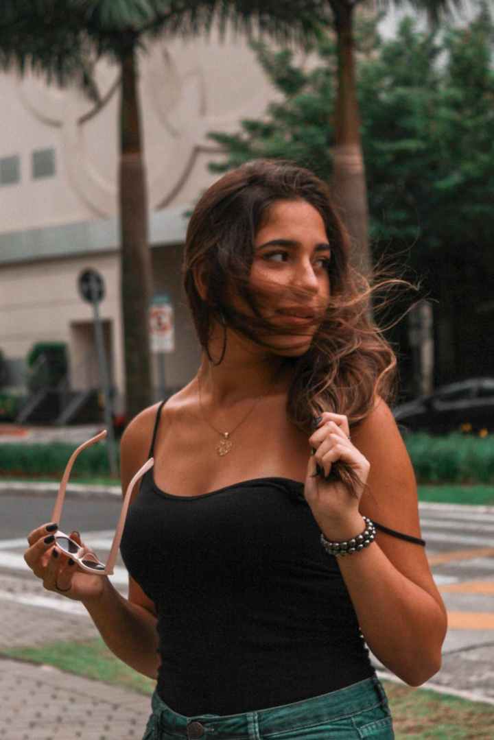 photo of woman wearing black camisole