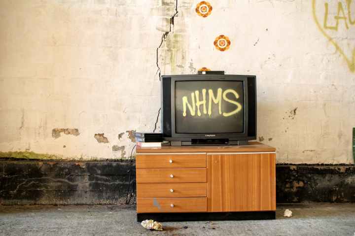 black crt television displaying nhms