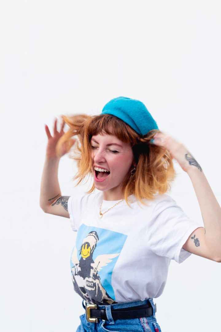 woman wearing shirt and denim bottoms